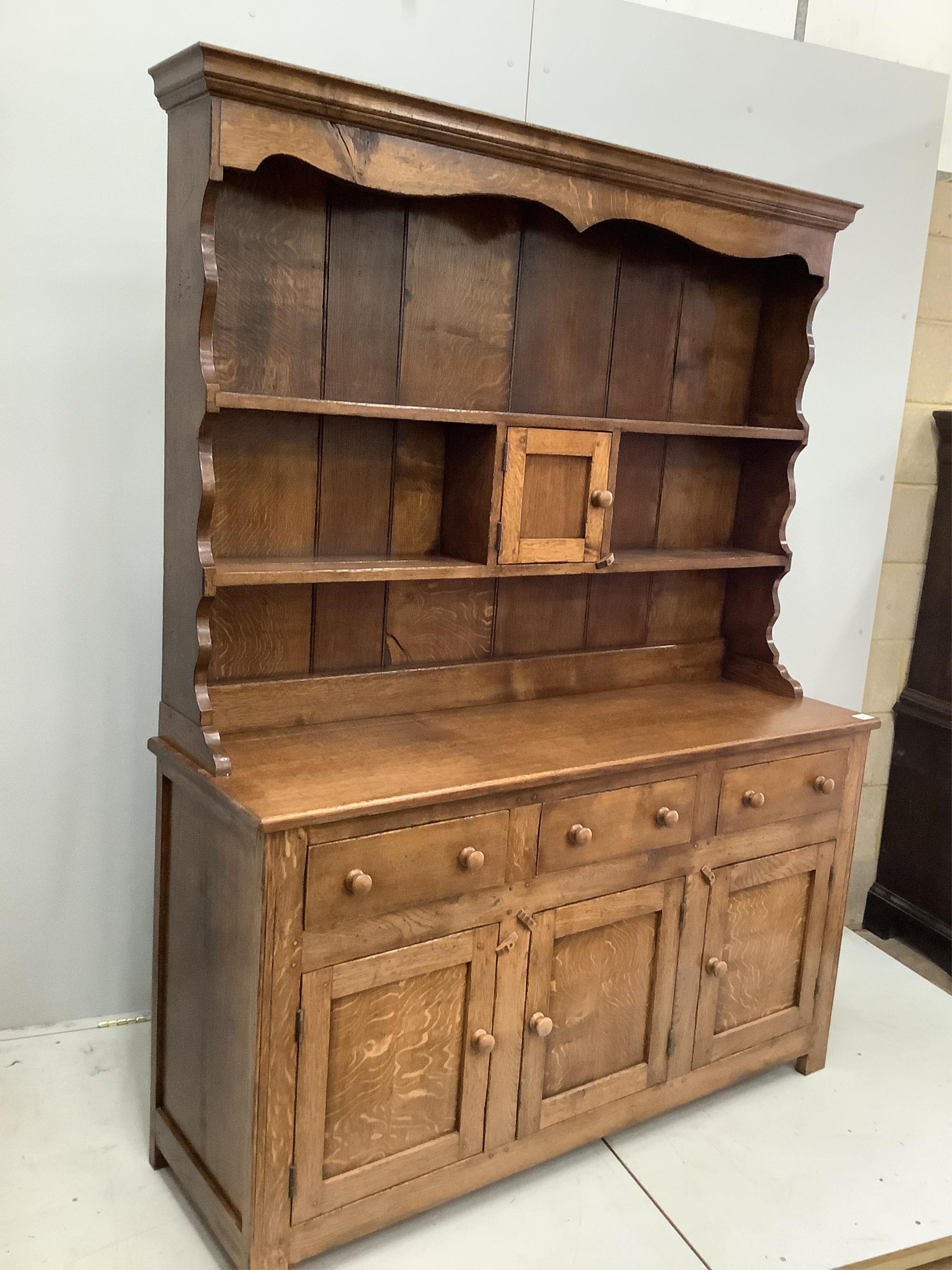 A near Contemporary 18th century style oak dresser, width 149cm, height 193cm. Condition - good